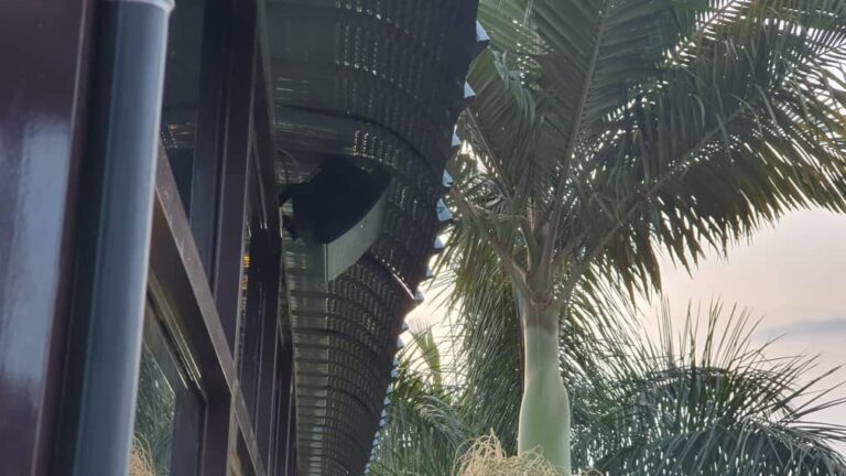 Outdoor speaker under the roof eaves at Afro Park Hotel