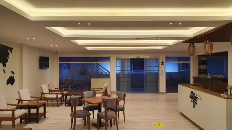 Covered rooftop lounge with ceiling speakers