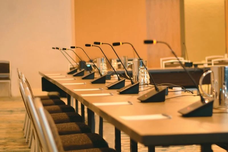 Audio-Technica ATUC conference system with delegate microphones on a meeting table