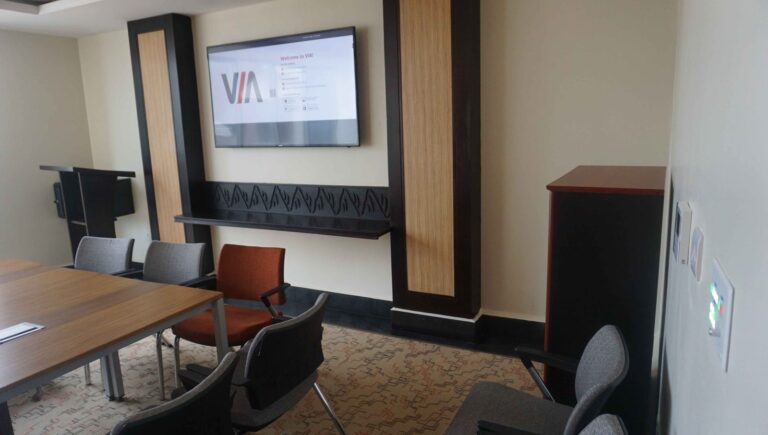 Boardroom with wall display and control panel