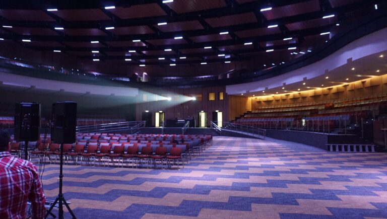 Projectors firing from the rear booths into the main hall