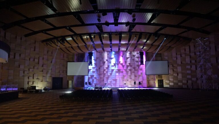 Main hall with line arrays and two projection screens