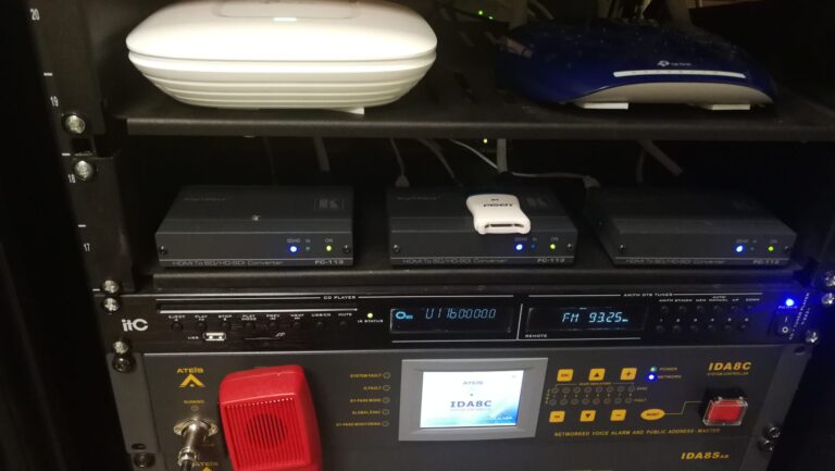 Equipment rack with public address controller and converters