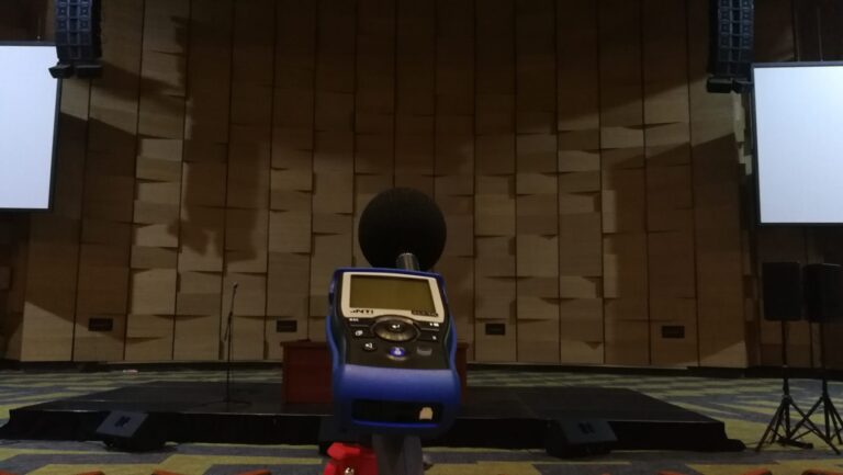 Sound level and speech intelligibility meter in front of the stage