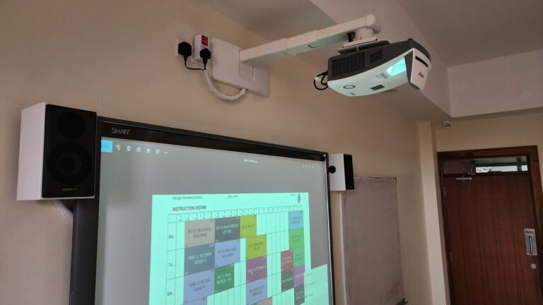 Vivitek ultra short throw projector on a wall arm