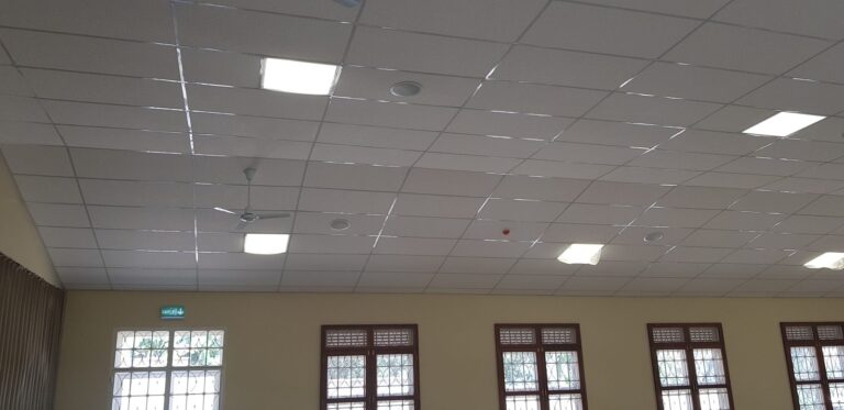 Ceiling speakers between the lights and fans