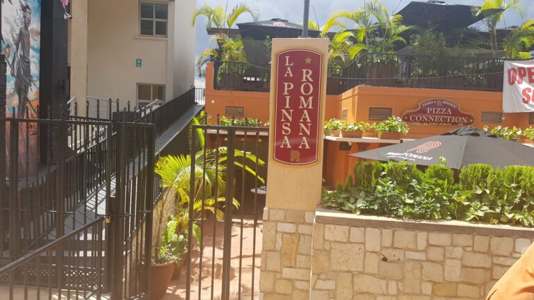 Pizza Connection entrance sign in Kisementi