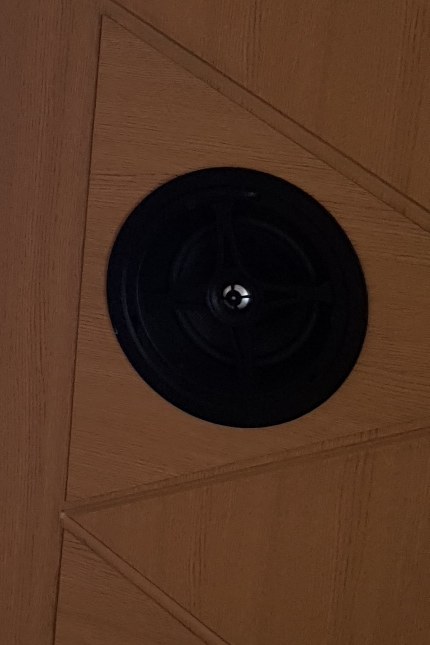 In-wall speaker set into the timber wall panel