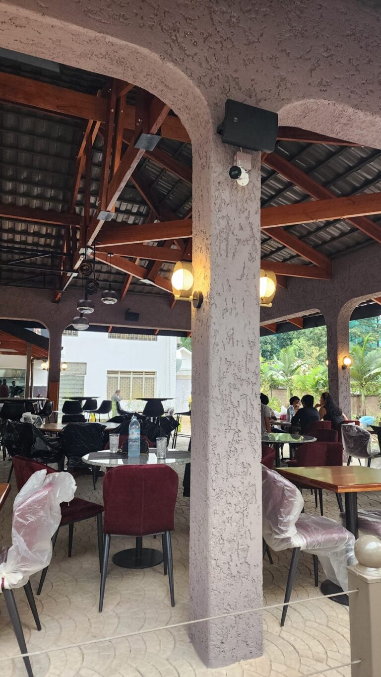 Speaker mounted at the top of a column at SOL Kololo