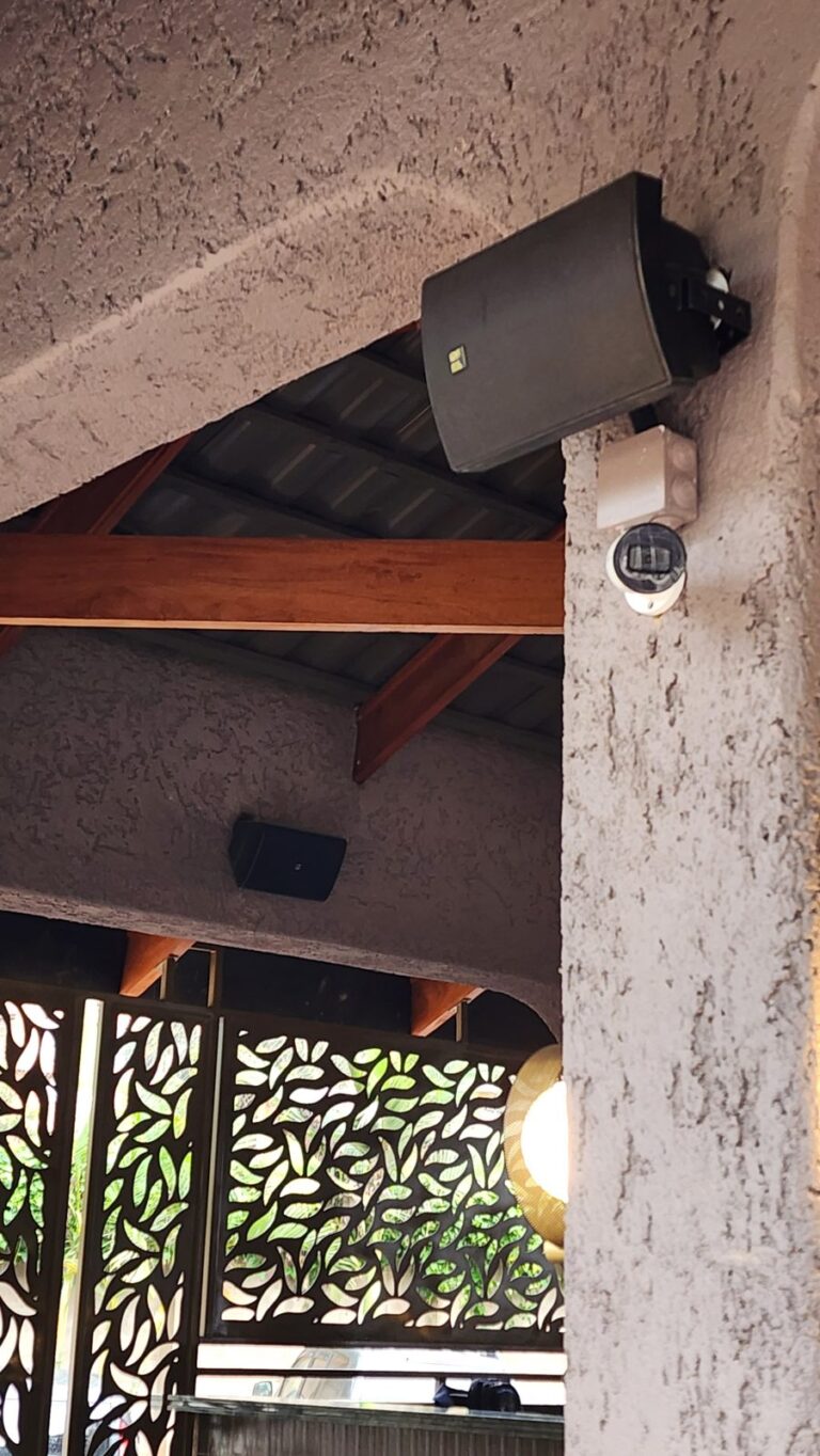 Close-up of a wall speaker on a bracket